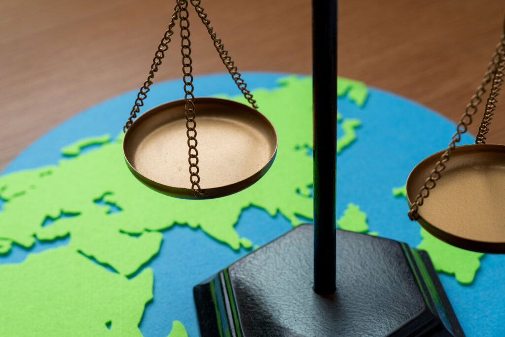 symbol of justice scales balanced above world map 2026 03 20 20 10 56 utc