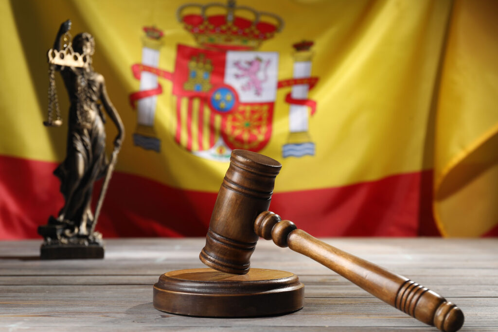wooden gavel and lady justice statue with spanish 2026 05 07 20 15 14 utc